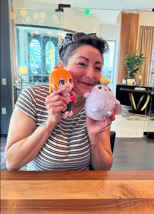 Hands holding the 6 inch Nibby Mini to show its palm size