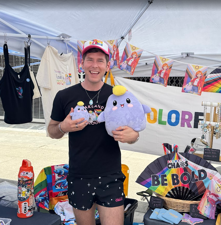 An adult proudly holding the 7 inch Chroma at a local outdoor market booth