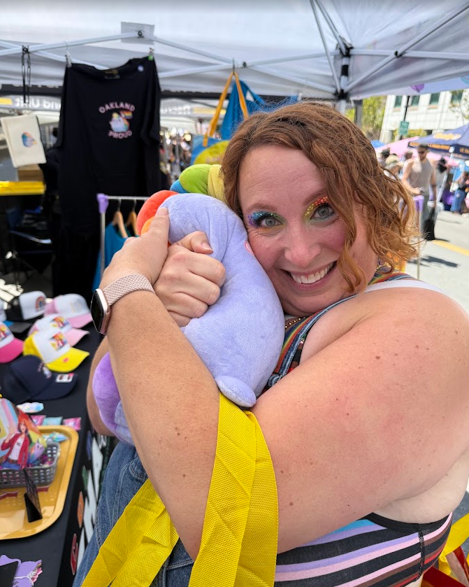 A customer's cheek pressed into the plushie, hands sinking into the soft sides